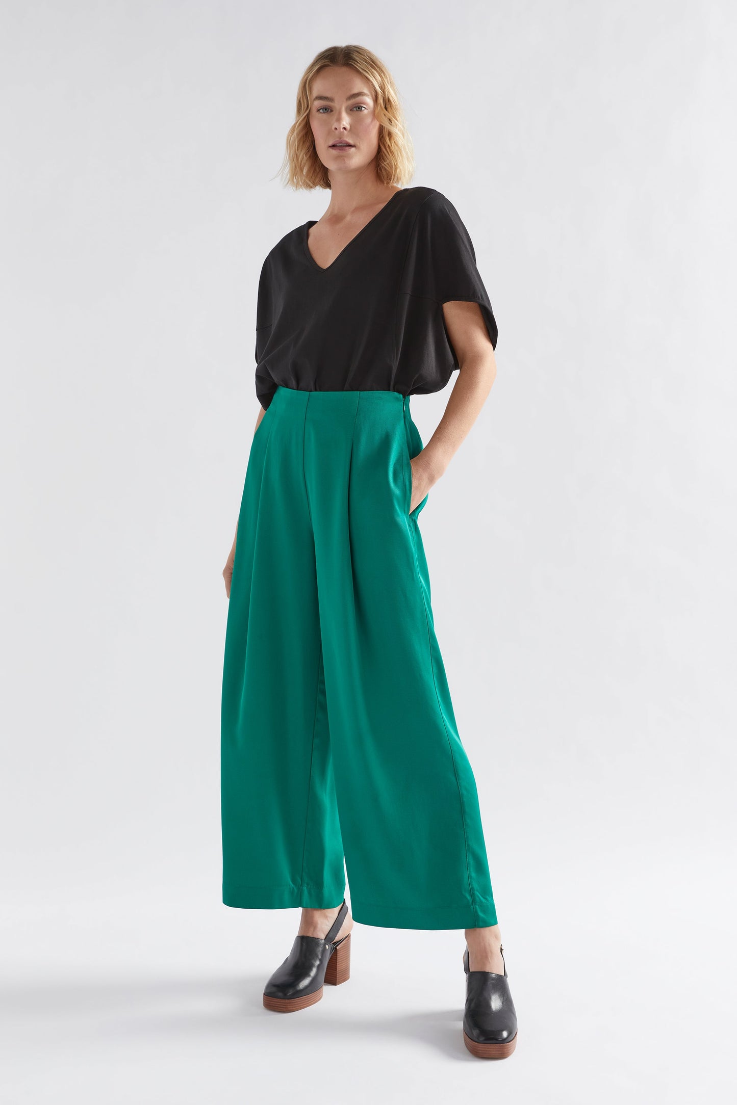 Vail High Waisted Wide Leg Pant Model Front full body with Black Nid Tee | JEWEL GREEN